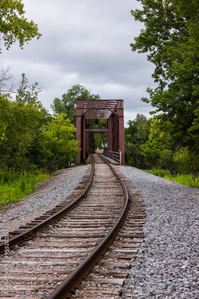 A Railroad Track Crossing An Old Truss Bridge A Railroad Track Crossing An Old Truss Bridge