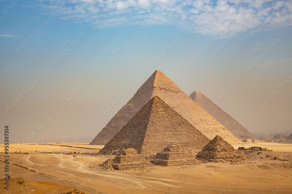 Egypt. Cairo - Giza. General view of pyramids from the Giza Plateau (three pyramids known as Queens' Pyramids on front side; next in order from left: the Pyramid of Menkaure, Khafre and Chufu Egypt. Cairo - Giza. General view of pyramids from the Giza Plateau (three pyramids known as Queens' Pyramids on front side; next in order from left: the Pyramid of Menkaure, Khafre and Chufu