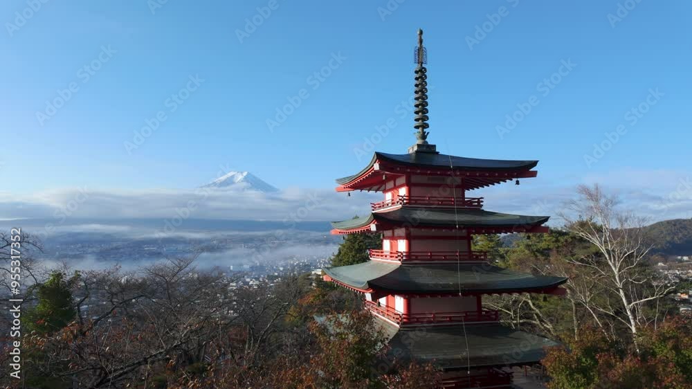 Panning shot showing Mount Fuji with the historic Chureito Pagoda during the autumn season in Fujiyoshida, Yamanashi, Japan. Panning shot showing Mount Fuji with the historic Chureito Pagoda during the autumn season in Fujiyoshida, Yamanashi, Japan.