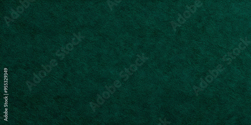 Seamless dark emerald green craft paper Christmas background texture. Rough textured thick cold pressed fibrous recycled cardboard or winter xmas holiday arts and craft card stock backdrop pattern.. photo