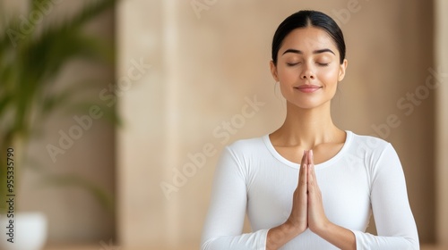 A serene woman practicing yoga in a calm environment, embodying tranquility and mindfulness with a peaceful expression. Free Download A serene woman practicing yoga in a calm environment, embodying tranquility and mindfulness with a peaceful expression. - GFXLoad