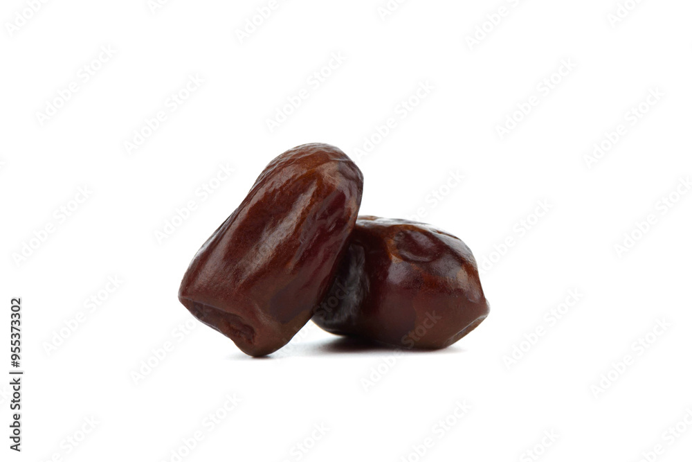 Two dried tropical dates isolated on white background. Two dried tropical dates isolated on white background.