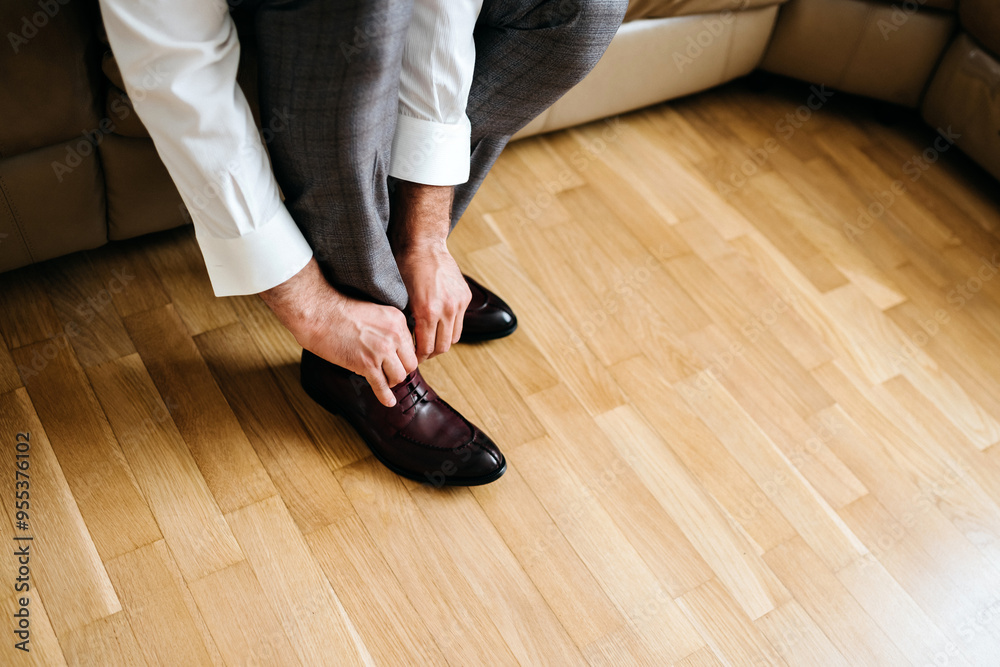 businessman putting on shoes, man getting ready for work, groom morning before wedding ceremony businessman putting on shoes, man getting ready for work, groom morning before wedding ceremony