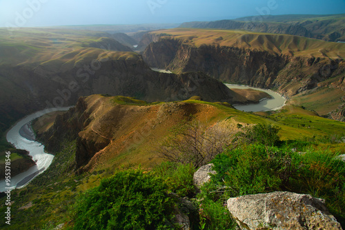 Kuokesu Grand Canyon, one of scenic areas in Kalajun Grassland which the landscape features are high gorges, flat lakes, snow-capped mountains, Tekes County, Ili Kazakh Autonomous Prefecture, Xinjiang photo