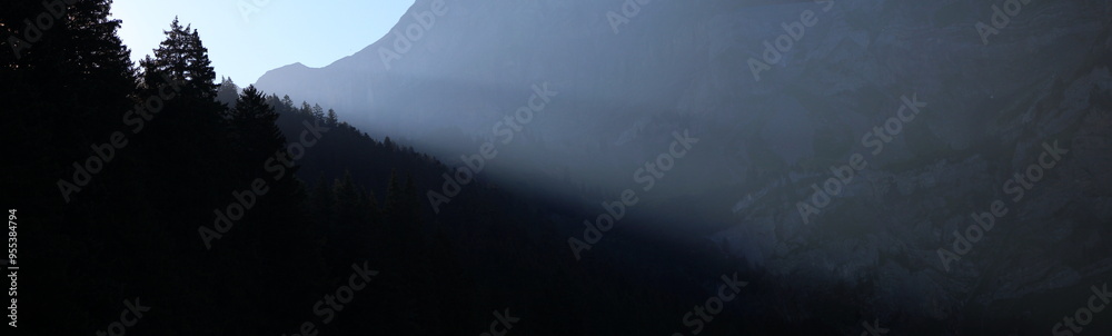 Fototapeta premium Morning Light Shining Into A Mountain Valley