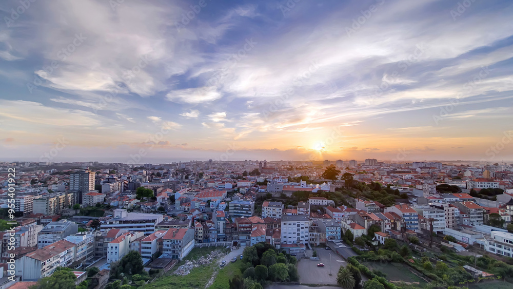 Fototapeta premium Rooftops of Porto's old town on a warm spring day timelapse during sunset, Porto, Portugal