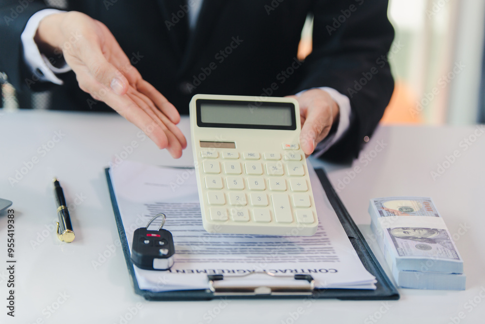 Car salesman signs car sales contract with cash and hands over keys to customer. Automotive business concept. Car salesman signs car sales contract with cash and hands over keys to customer. Automotive business concept.