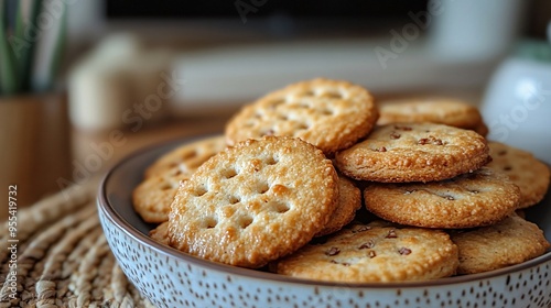 Round wheat crackers piled in a modern bowl