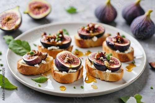 Wallpaper Mural Fig and Goat Cheese Crostini: Overhead view of a few fig and goat cheese crostini arranged neatly on a plain white plate Torontodigital.ca