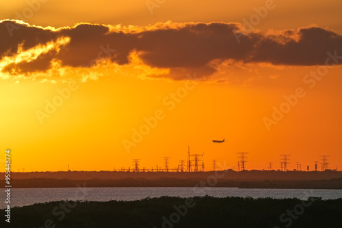 landscape of landing airplane and dramatic sky at Cancun coast