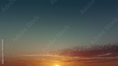 Sunset Sky: A breathtaking panorama of a vibrant sunset, capturing the sun's golden rays illuminating the clouds in a symphony of warm hues. The sky transitions from a deep azure to a fiery orange, c