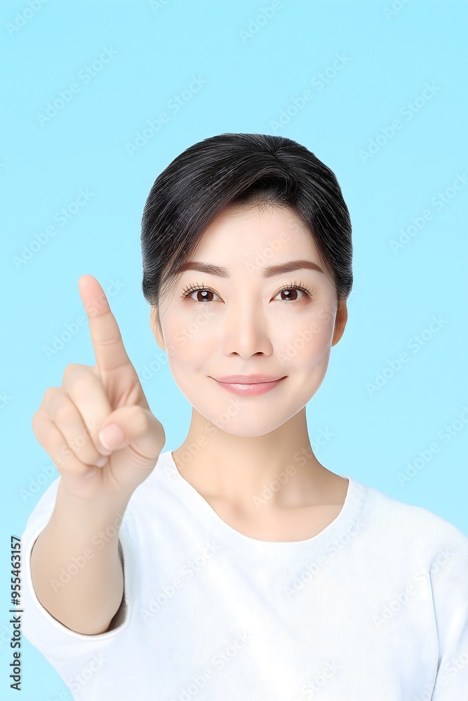 An Asian beauty model gesturing against an isolated background, perfect for a business or commercial wallpaper with blank space for writing. An Asian beauty model gesturing against an isolated background, perfect for a business or commercial wallpaper with blank space for writing.