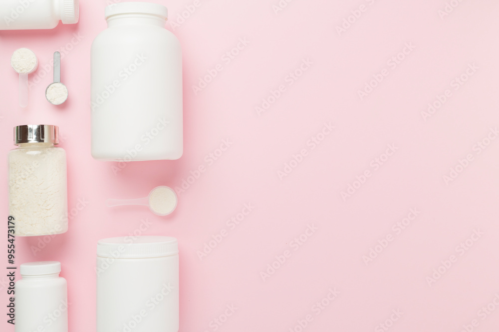 Jars with protein powder on color background, top view. Sports nutrition concept