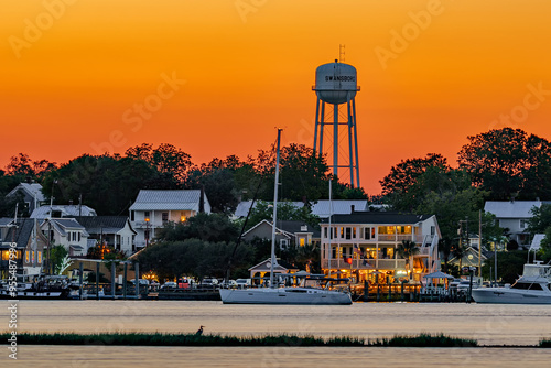 sunset on the waterfront of a city