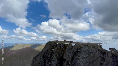 Pan across the north face of Ben Nevis from the Great Glen to the busy summit, Highlands, Scotland.