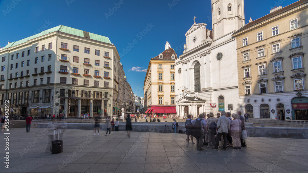 Fototapeta premium St. Michael's Church timelapse hyperlapse at Michaelerplatz from St. Michael's Gate of Hofburg