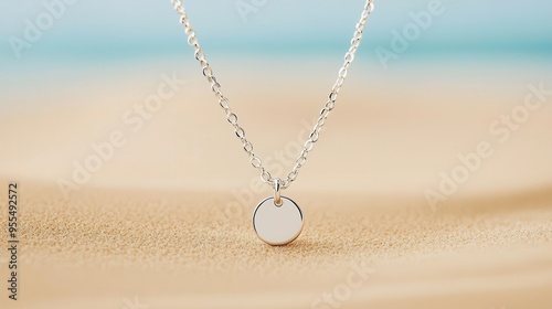 A minimalistic necklace with a tiny engraved charm, close-up, soft lighting, neutral background