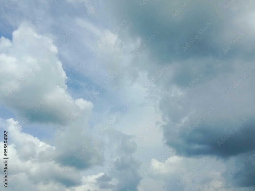 A clear blue sky with a few clouds. The sky is so clear that it almost looks like a painting A clear blue sky with a few clouds. The sky is so clear that it almost looks like a painting