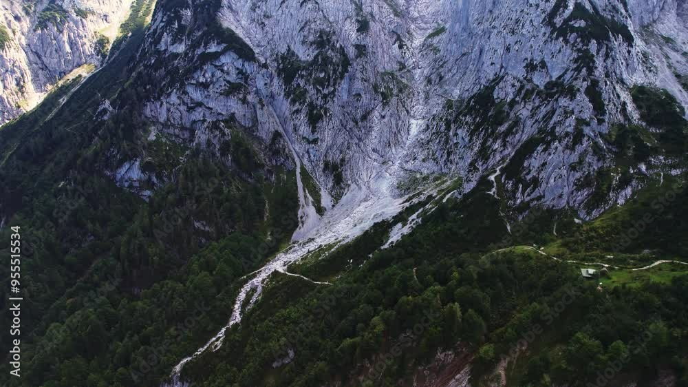 4K Aerial Drone video of Kaiserbachtal rocky gray mountains with prominent peaks on a sunny summer day with blue skies in Tirol Austria 4K Aerial Drone video of Kaiserbachtal rocky gray mountains with prominent peaks on a sunny summer day with blue skies in Tirol Austria