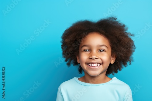 Blue background Happy black american african child Portrait of young beautiful kid Isolated on Background ethnic diversity equality acceptance concept