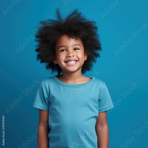 Blue background Happy black american african child Portrait of young beautiful kid Isolated on Background ethnic diversity equality acceptance concept