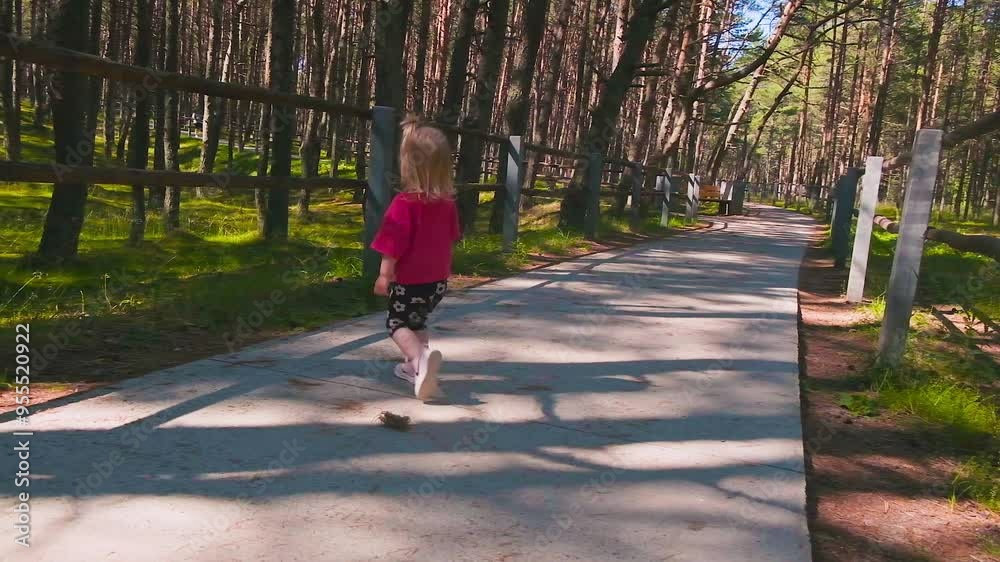 Child toddler girl walks and travels along the Curonian Spit in the Kaliningrad region. Child toddler girl walks and travels along the Curonian Spit in the Kaliningrad region.