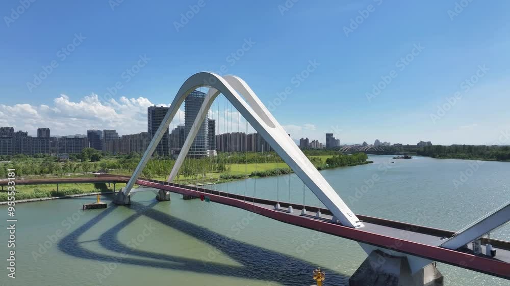 view of bridge over river in blue sky view of bridge over river in blue sky