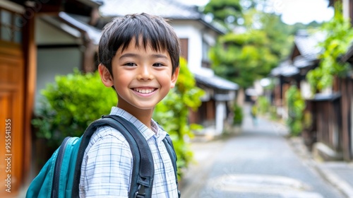 Asian school boy smiling while walking at school with backpack on back