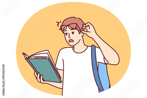 Shocked guy student with book reads amazing smart facts in textbook which causes wow effect. Young man lifts glasses from eyes after reading shocking information in book given by college teacher