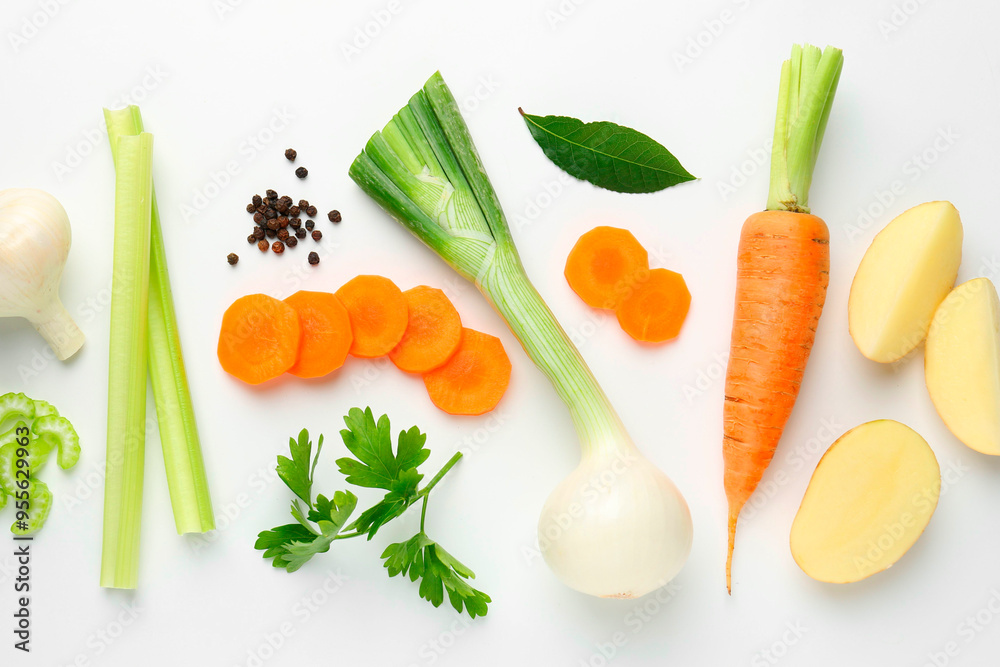 Pieces of fresh ripe carrots, vegetables and spices on white background, flat lay Pieces of fresh ripe carrots, vegetables and spices on white background, flat lay