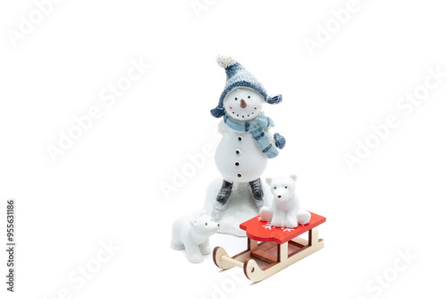 Snowman figure with polar bears and red sledge photo