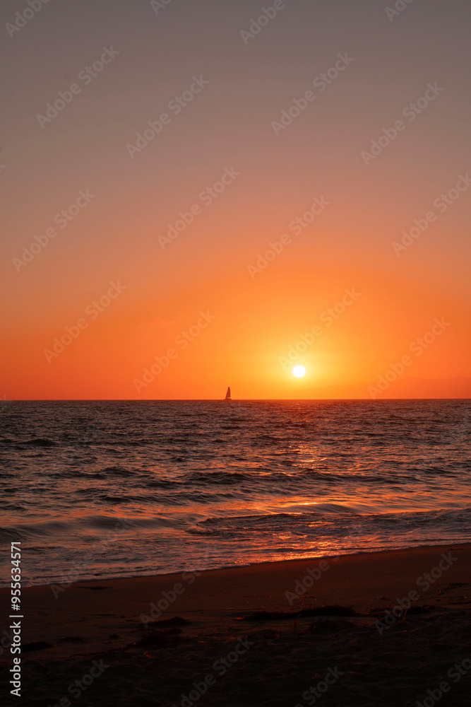 Sunset and sailboat on the beach in Los Angeles Sunset and sailboat on the beach in Los Angeles
