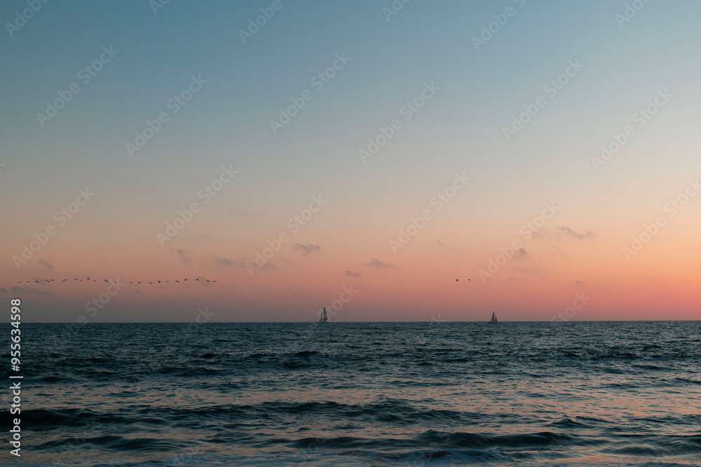 Golden hour with sailboat in the horizons in Los Angeles Golden hour with sailboat in the horizons in Los Angeles