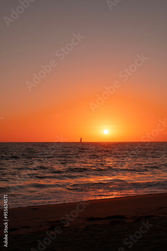 Sunset and sailboat on the beach in Los Angeles