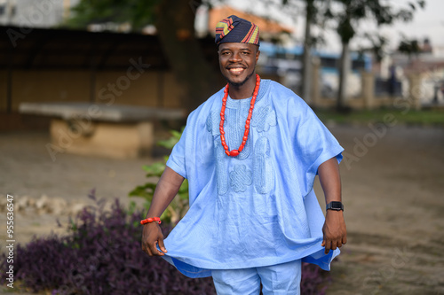 Nigerian man confidently wearing vibrant Danshiki, reflecting cultural heritage and pride photo