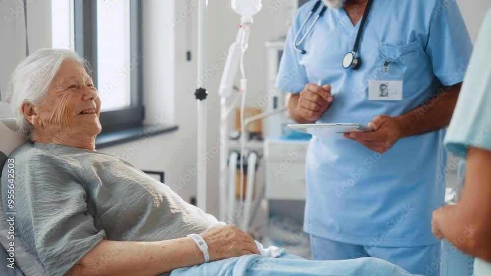 Old 80s old grandmother, female patient lying in bed in hospital smiling talking to doctor and nurse during ward visit. Old 80s old grandmother, female patient lying in bed in hospital smiling talking to doctor and nurse during ward visit.