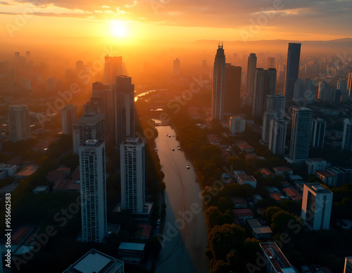 Aerial View of Modern City Skyline at Sunrise with Warm Golden Light
