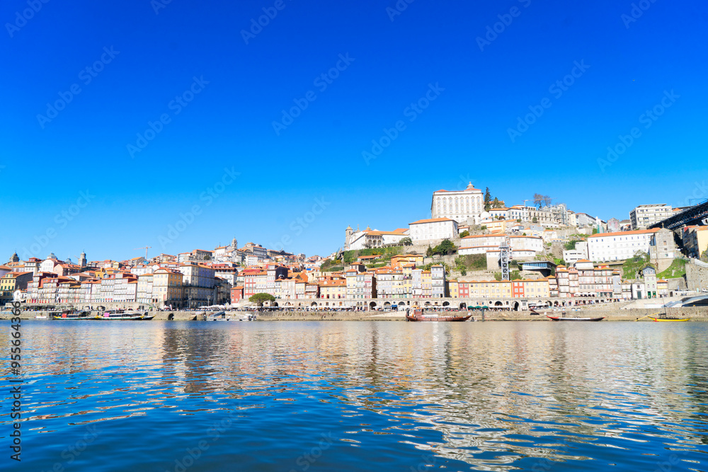 Naklejka premium Picturesque, colorful view at old town Porto, Portugal with bridge Ponte Dom Luis over Douro river. Oporto, touristic mediterranean city