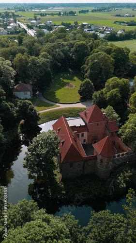 View of the castle in the middle of the forest. Drone view of the castle. A castle in the middle of the forest. Oporów Castle , Poland photo