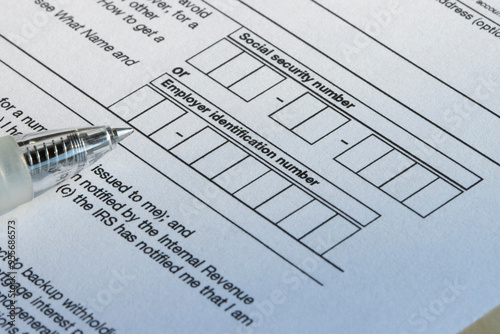 Closeup of the boxes for social security number (SSN) or employer identification number (EIN) on Form W-9, Request for Taxpayer Identification Number (TIN) and Certification.