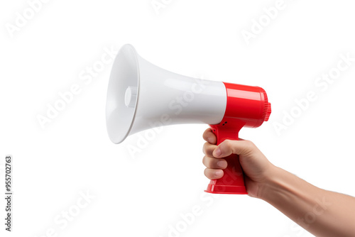 A person stands holding a red and white megaphone, ready to amplify their voice in a public setting.
