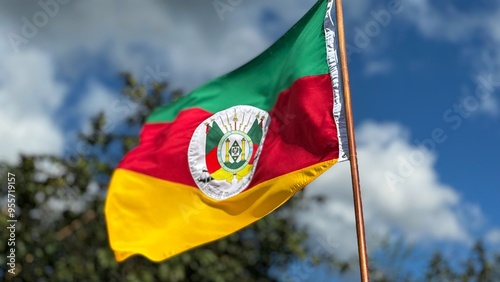 Flag of the State of Rio Grande do Sul waving in the wind on a nature background. Gaucho Flag. Week in the South of Brazil Farroupilha dos Gaúchos. photo