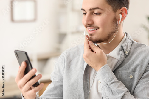 Young man with mobile phone...
