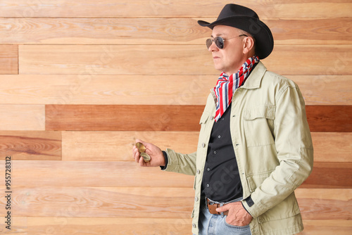 Mature cowboy with compass ...