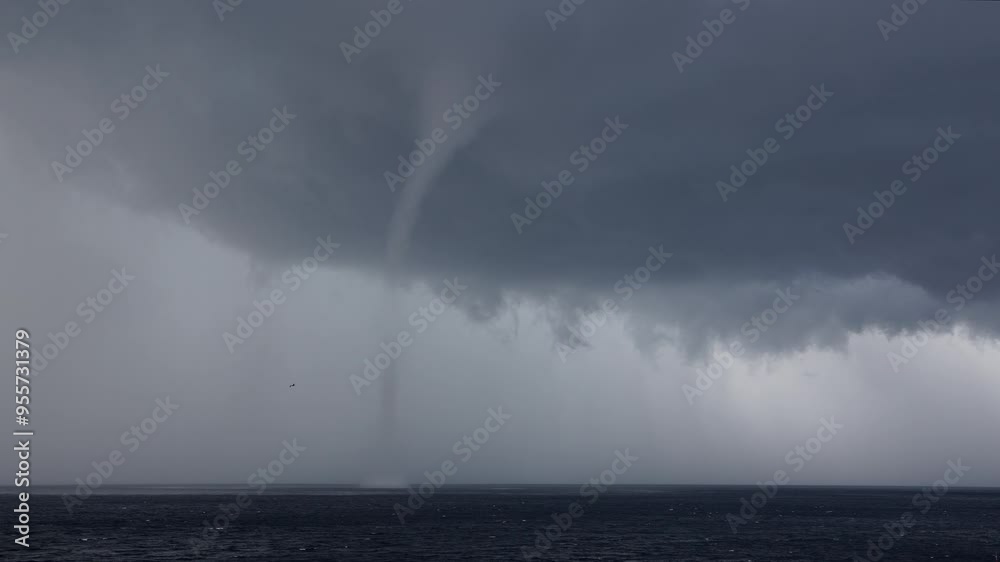 Time-lapse with thunderstorm and tornado over the ocean Time-lapse with thunderstorm and tornado over the ocean