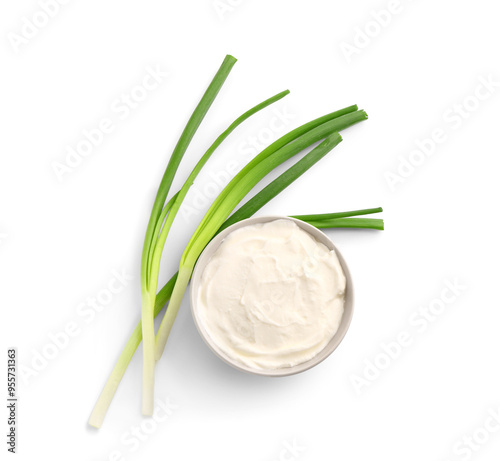 Bowl of tasty sour cream with green onion on white background photo