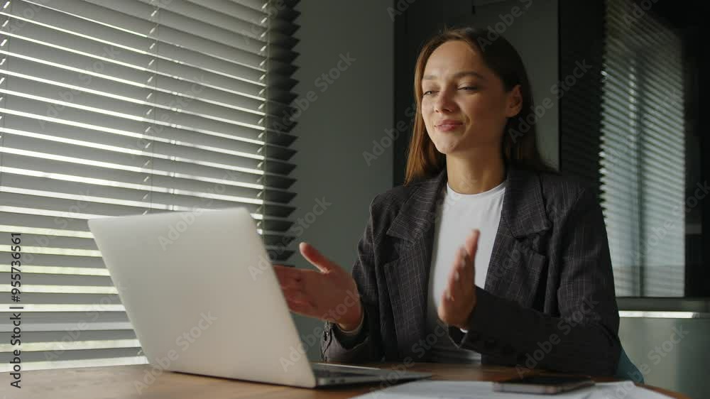 Young woman communicating by conference call speak looking at computer at home office, video chat job interview or distance language course class with online teacher. Young woman communicating by conference call speak looking at computer at home office, video chat job interview or distance language course class with online teacher.