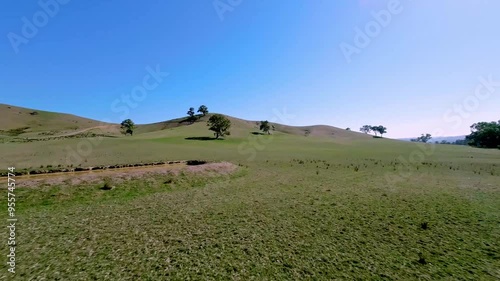 Flying over rolling hills and countryside