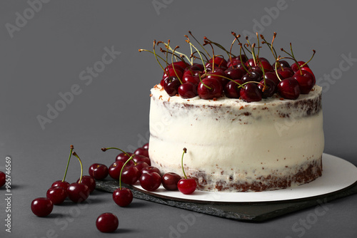 Board with tasty cherry cak...