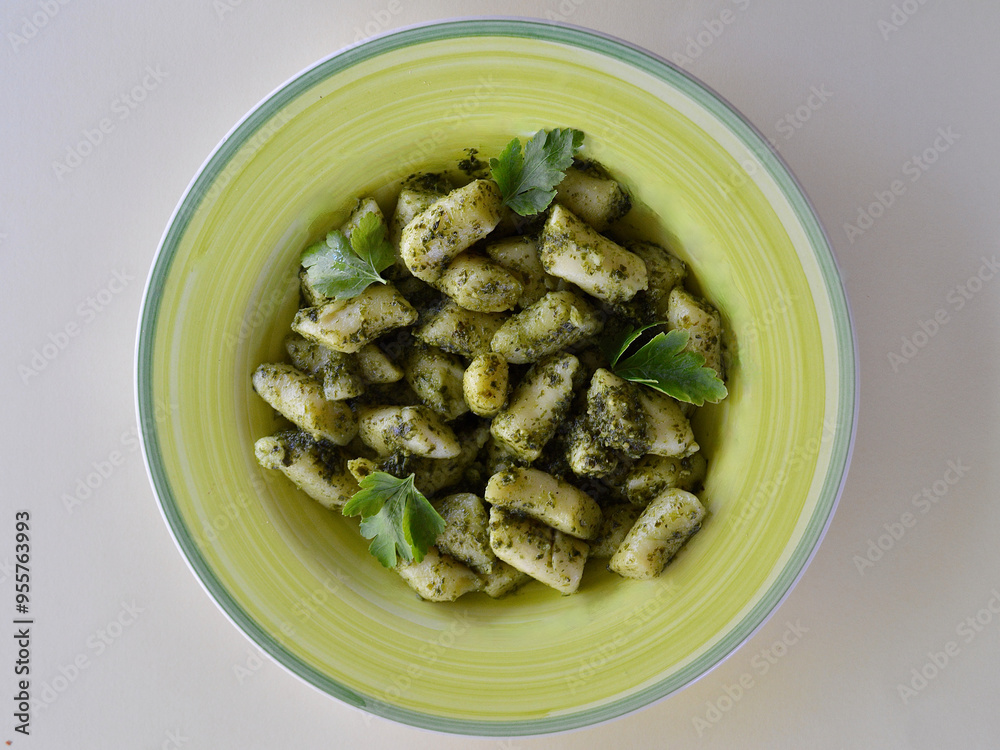 Gnocchi basil pesto on the table. Gnocchi basil pesto on the table.
